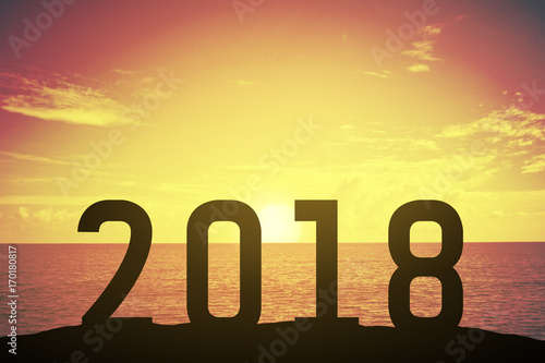 Silhouette 2018 number over a beautiful sunset or sunrise at the sea. background for happy new years. success in 2018 years. Happy celebrating. Hope to success. tomorrow has coming concept