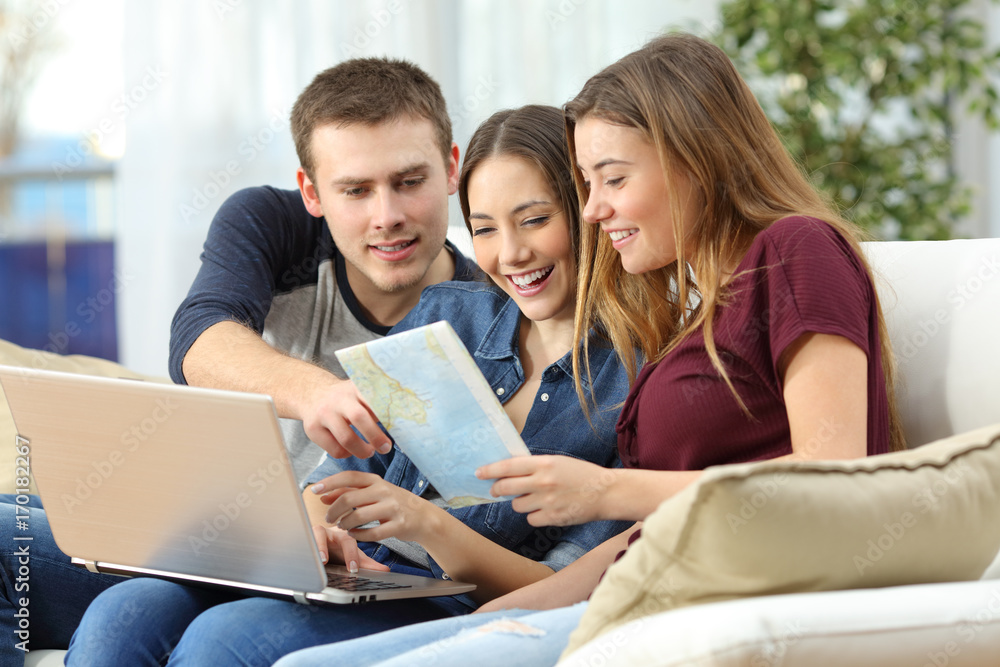 Three friends planning travel at home Three friends planning travel at home