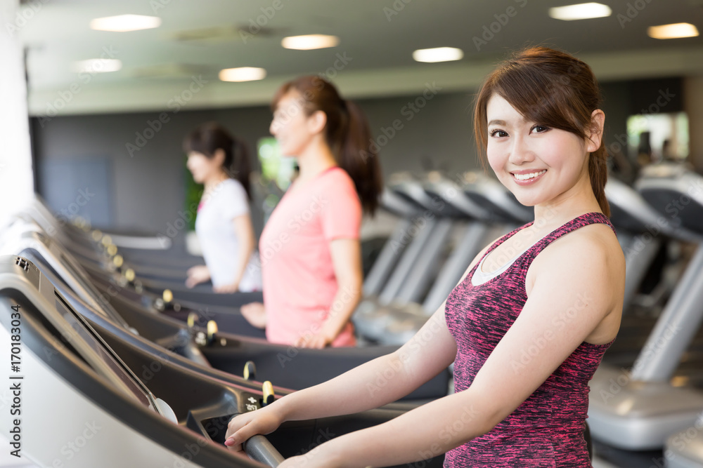 sporty asian women exercising in sports gym