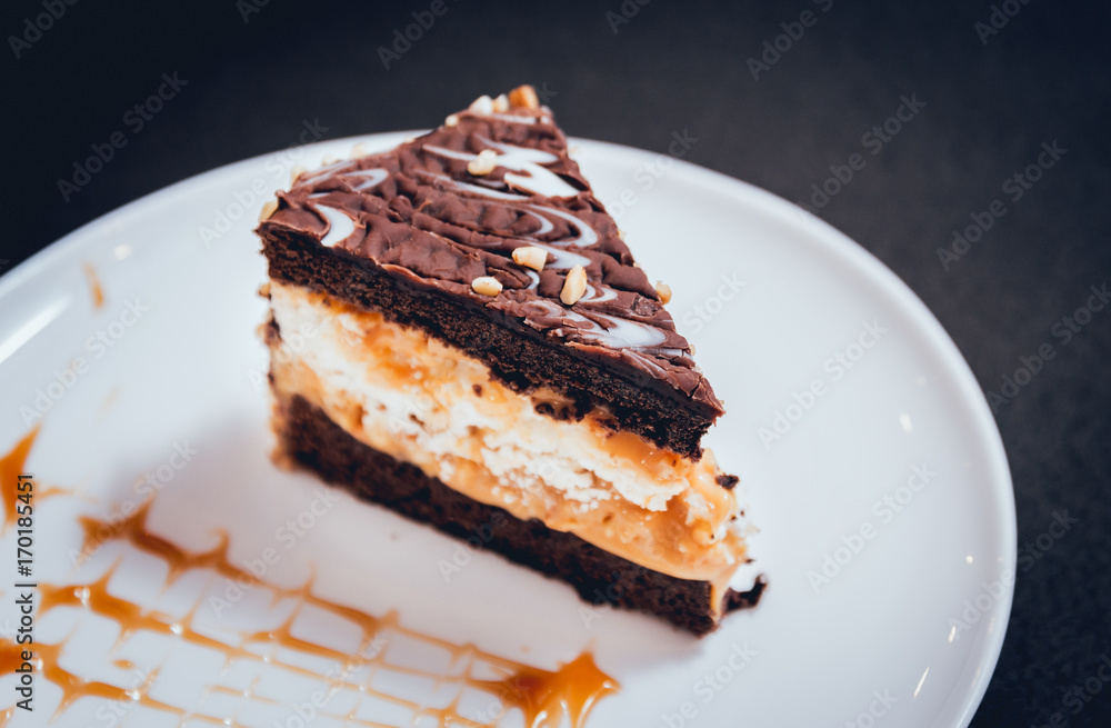 Dessert with cream on the wihte plate