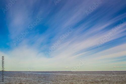 Blue sky over the water.