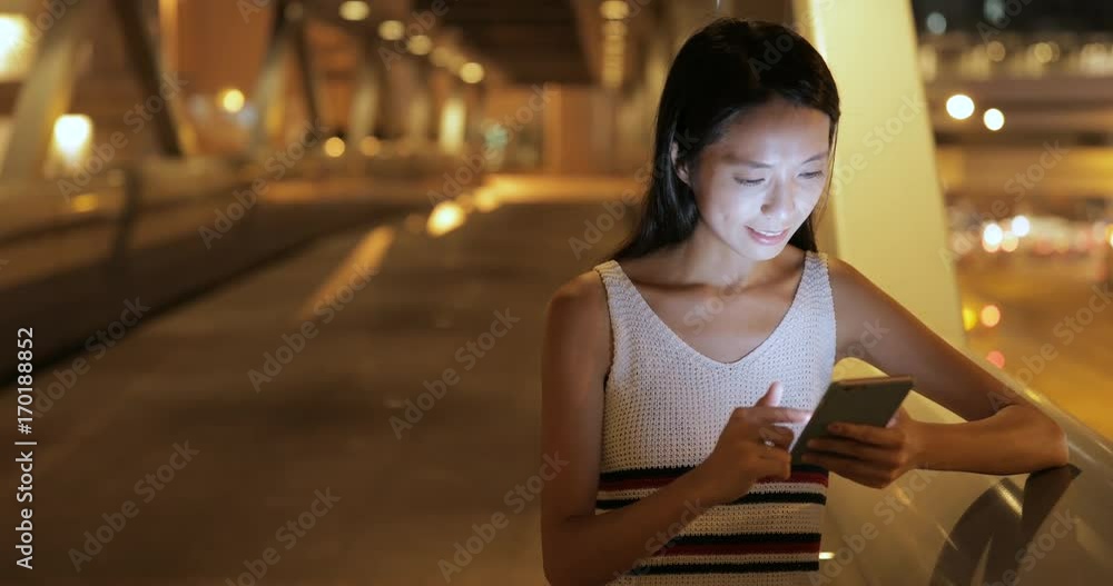 Woman using mobile phone in the city Woman using mobile phone in the city