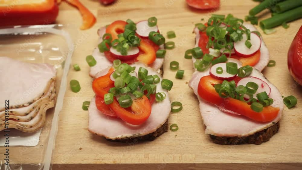 Table wooden board full of fresh food vegetables to make sandwich. Dolly sliding shot 4K ProRes HQ codec Table wooden board full of fresh food vegetables to make sandwich. Dolly sliding shot 4K ProRes HQ codec