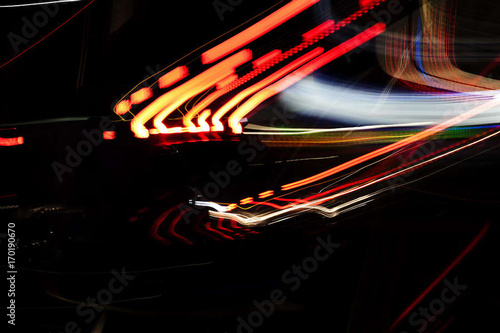 Abstract Pattern Of Neon Lights Streaked On Dark Background