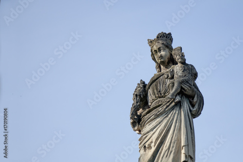 Partially destroyed ancient statue of the Virgin Mary with the baby Jesus Christ  Religion  faith  eternal life  God  the soul concept 