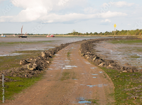road leading onto island with tide out black water Maldon