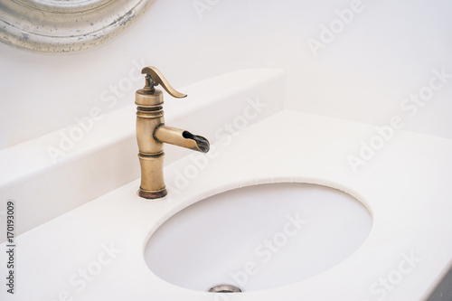 Brass faucet vintage design on wash basin