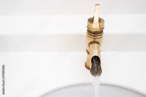 Brass faucet vintage design on wash basin