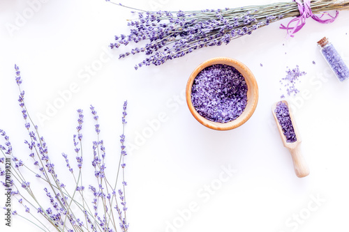 Fototapeta Naklejka Na Ścianę i Meble -  natural cosmetics with lavender and herbs for homemade spa on white background top view mock up