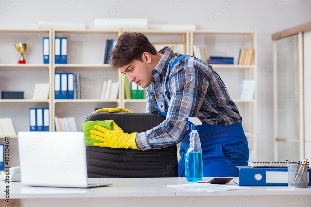 Male cleaner working in the office Male cleaner working in the office