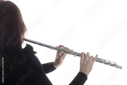 Flute music. Flutist hands flute instrument