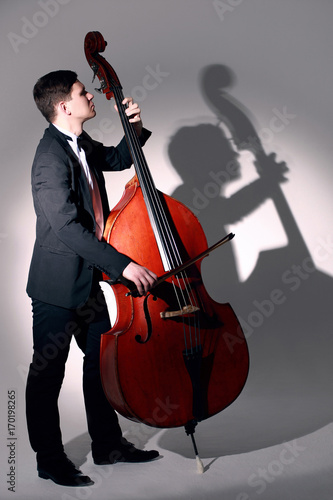 Double bass player playing contrabass Jazz musician