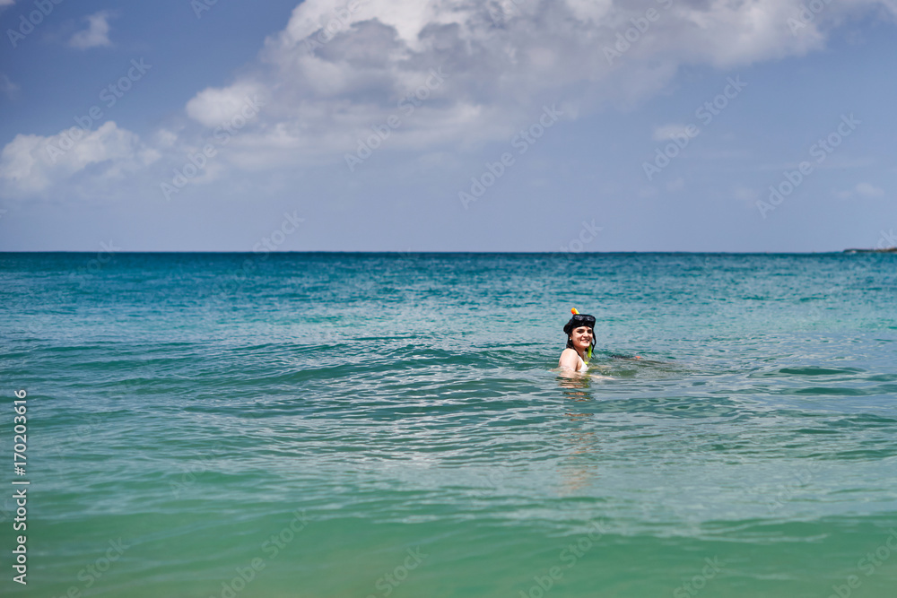 1407872 Woman doing snorkeling at sea 1407872 Woman doing snorkeling at sea