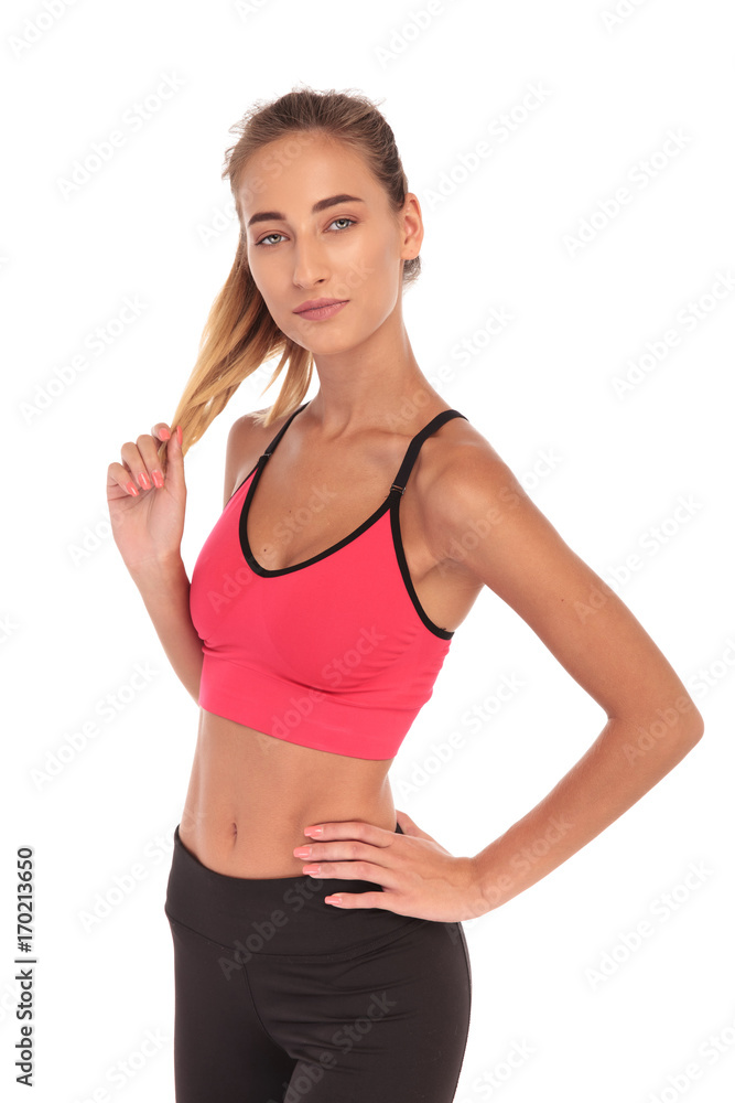smiling sporty woman playing with her hair smiling sporty woman playing with her hair