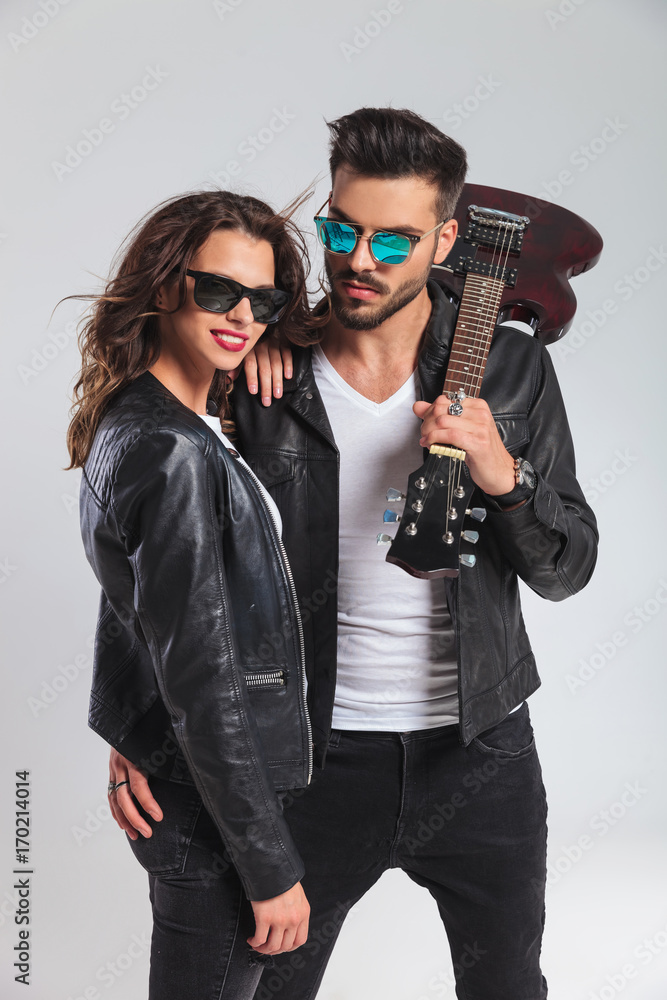 rock and roll woman laughing while leaning on man rock and roll woman laughing while leaning on man