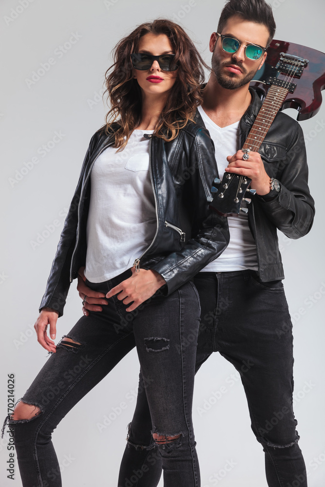 fashion rock and roll couple standing together fashion rock and roll couple standing together