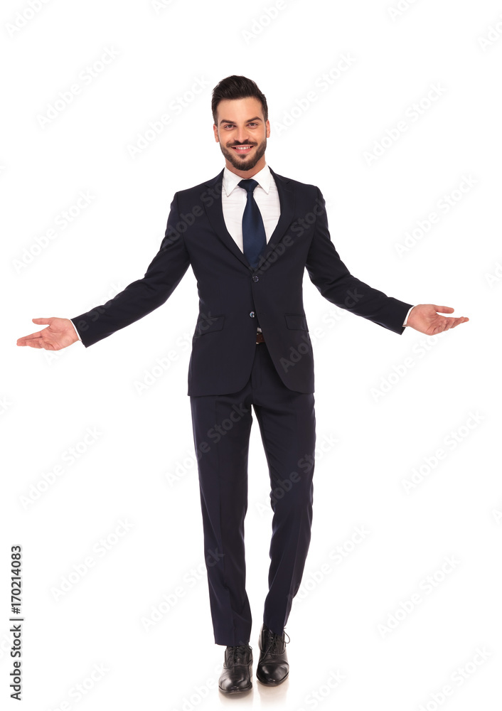 happy smiling young business man welcoming you happy smiling young business man welcoming you