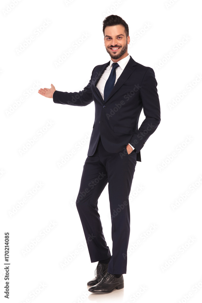 happy modern young business man presenting and smiling happy modern young business man presenting and smiling