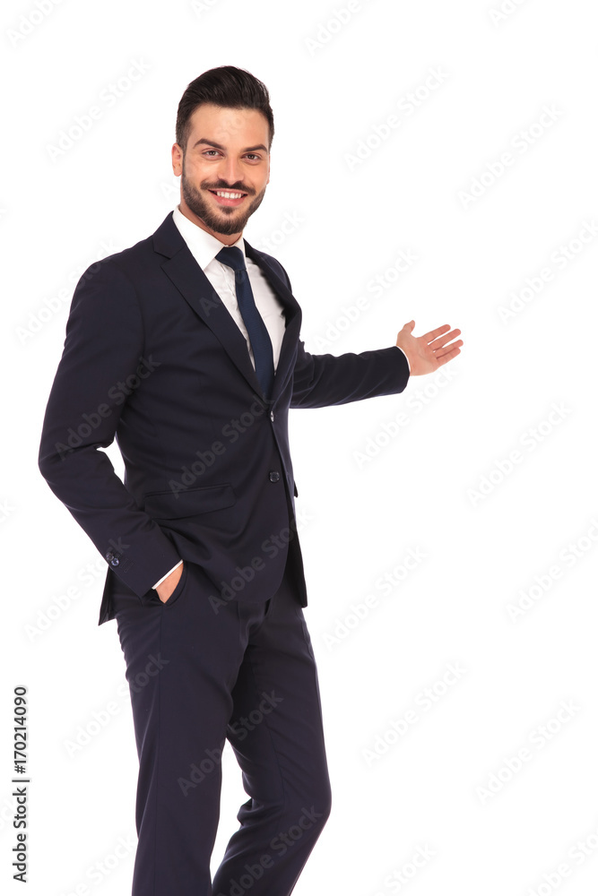 happy young business man presenting and smiling happy young business man presenting and smiling