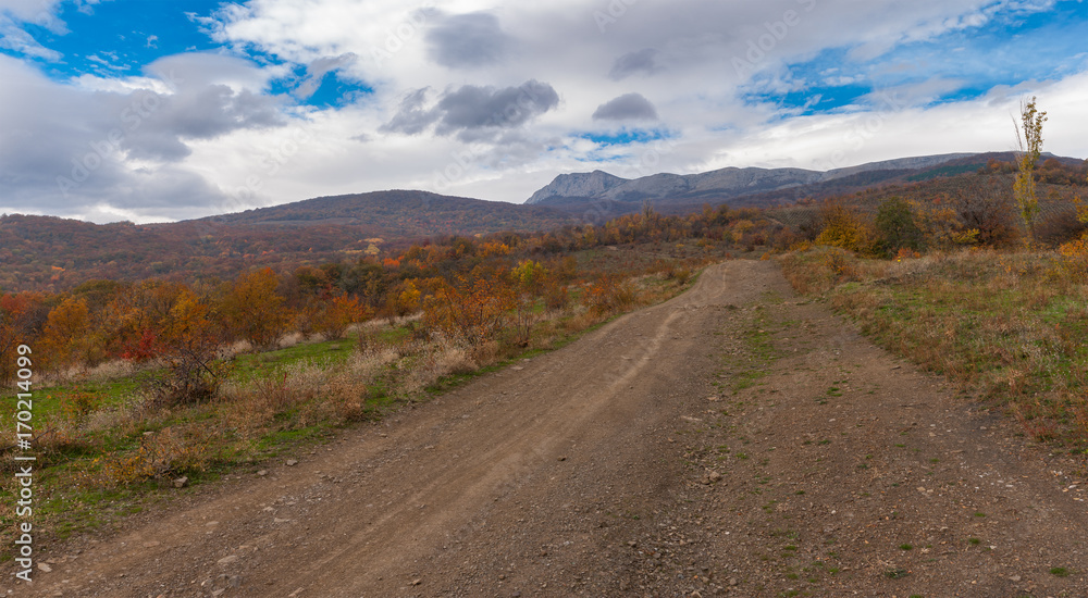 Panoramic mountain landscape with an earth road near Alushta city at fall season, Crimean peninsula