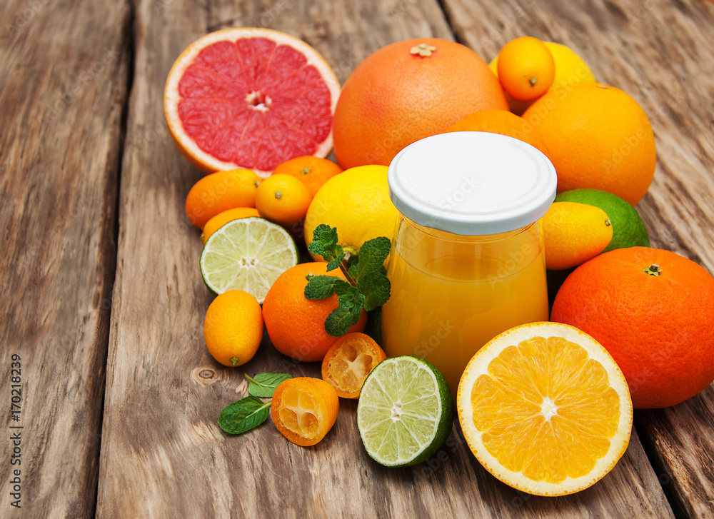 Jar of juice and fresh citrus fruits Jar of juice and fresh citrus fruits