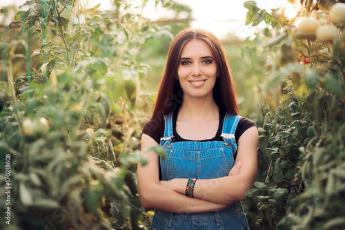 Fotografie Happy Countryside Woman Proud of Her Vegetable Greenhouse Garden