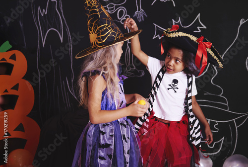 Two girls spending time together at halloween party