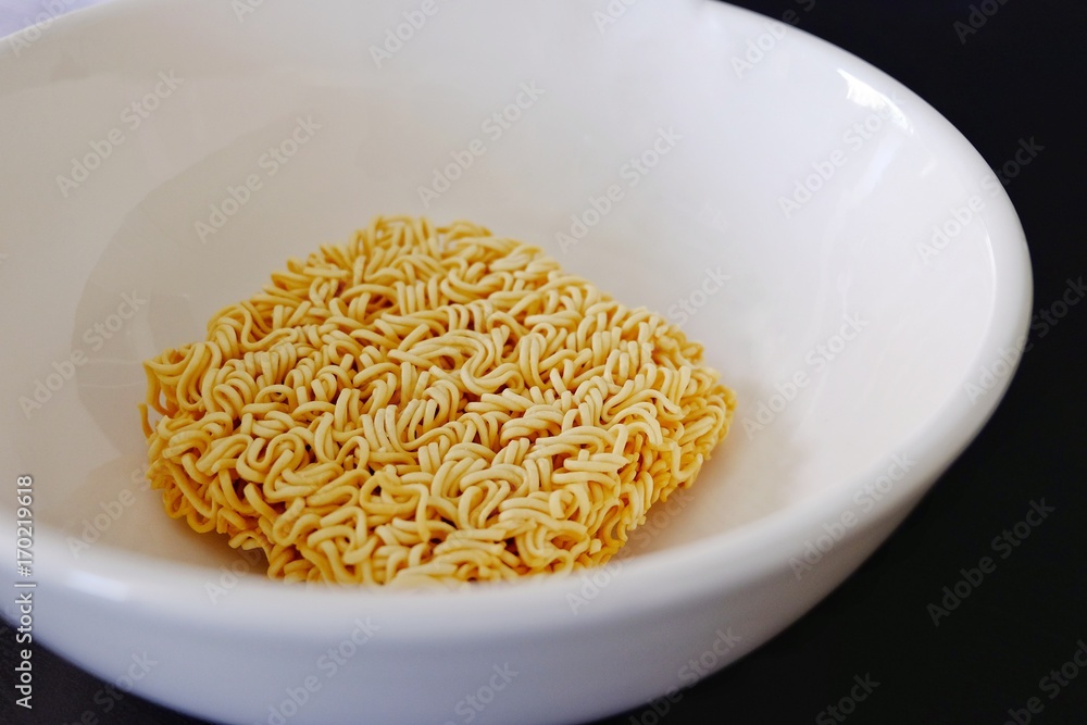 Instant noodles in a white bowl. Instant noodles in a white bowl.