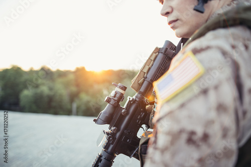 Military, war, conflict, soldiers - Special forces soldier man hold Machine gun. Military equipment NATO soldiers photo