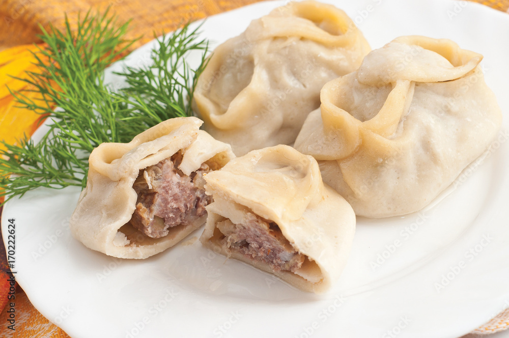 Beef manta dumplings with meat on the plate Beef manta dumplings with meat on the plate