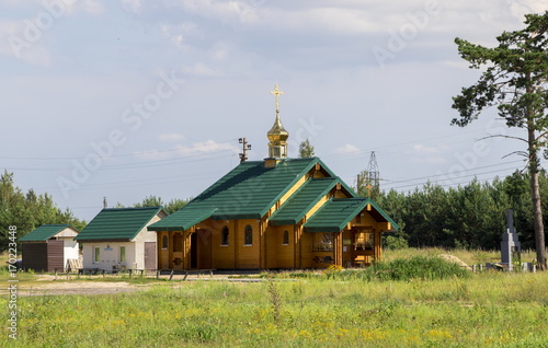 Wooden orthodox church of the Holy Prince Oleg Bryansk in Dobrush city photo