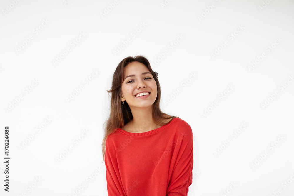 Joy and happiness concept. Picture of stunning Hispanic student girl with brown loose hair grinning broadly, feeling happy and carefree after she passed all exams and now enjoying leisure time Joy and happiness concept. Picture of stunning Hispanic student girl with brown loose hair grinning broadly, feeling happy and carefree after she passed all exams and now enjoying leisure time