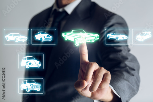 Businessman is shopping online to choose a cars to buy about internet of thing concept, Business background.