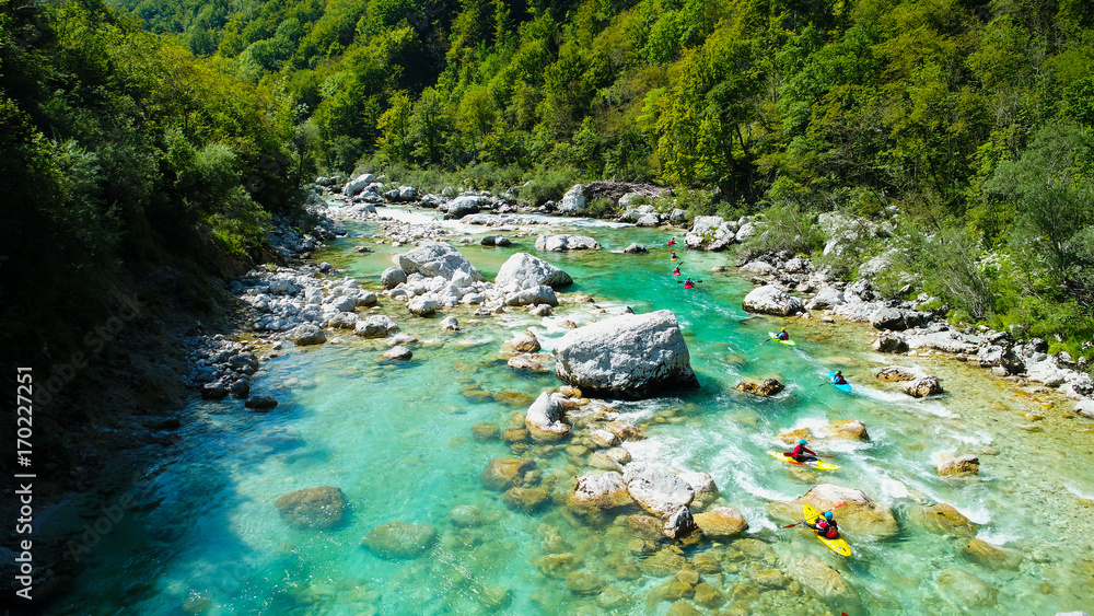 Emerald waters of Soca river, Slovenia, are the rafting paradise for adrenaline seekers and also nature lovers, aerial view. Emerald waters of Soca river, Slovenia, are the rafting paradise for adrenaline seekers and also nature lovers, aerial view.