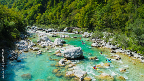 Foto Emerald waters of Soca river, Slovenia, are the rafting paradise for adrenaline seekers and also nature lovers, aerial view