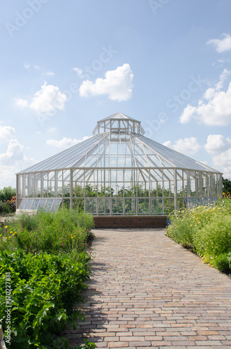 Large greenhouse with path in foreground
