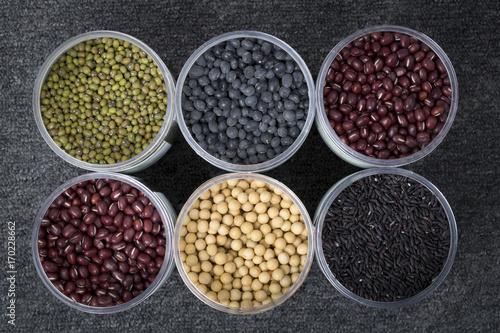 The ranks of different beans: soybean, mung bean, bean, black bean. And black rice. View from above. 