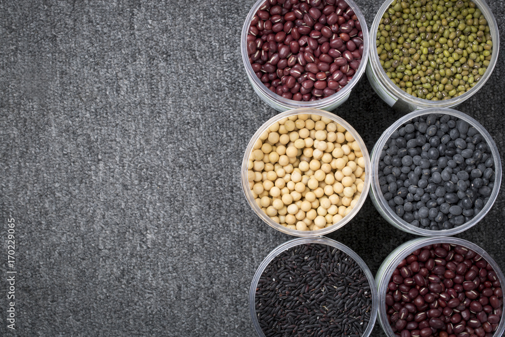 The ranks of different beans: soybean, mung bean, bean, black bean. And black rice. View from above. And copyspace. The ranks of different beans: soybean, mung bean, bean, black bean. And black rice. View from above. And copyspace.