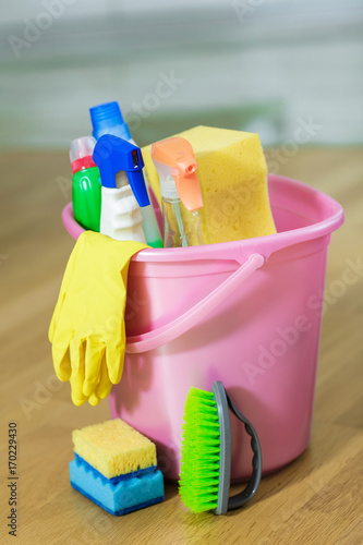 Plastic bucket with cleaning product at home