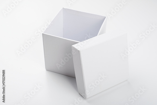 Top view of open white box with lid on white background. Isolated.