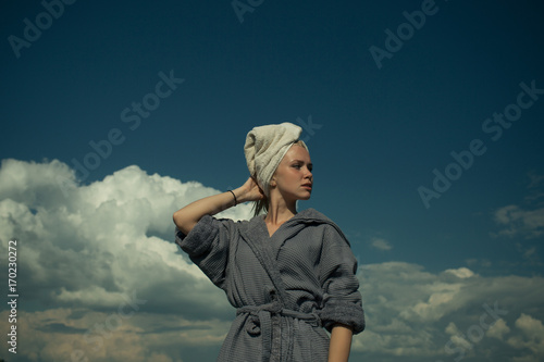 Woman in bathrobe and towel on head