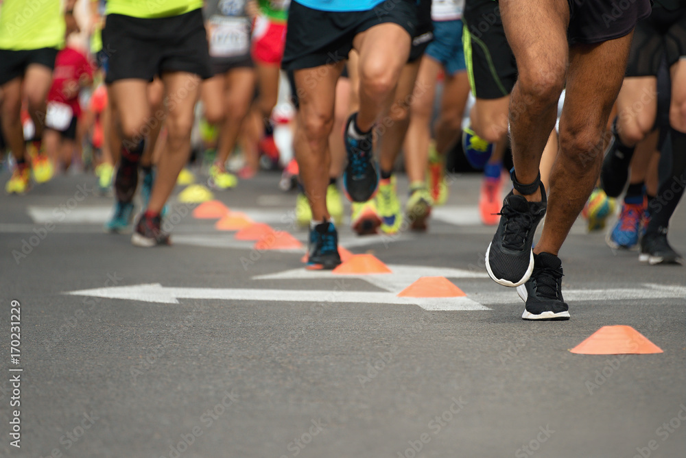 Marathon running race, people feet on city road