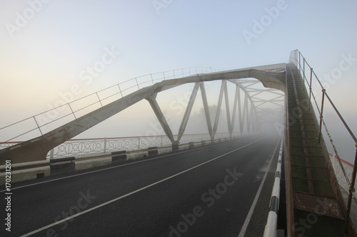 Fototapeta Naklejka Na Ścianę i Meble -  bridge in fog at sunrise