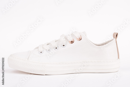 Pair of new white sneakers, isolated on white background