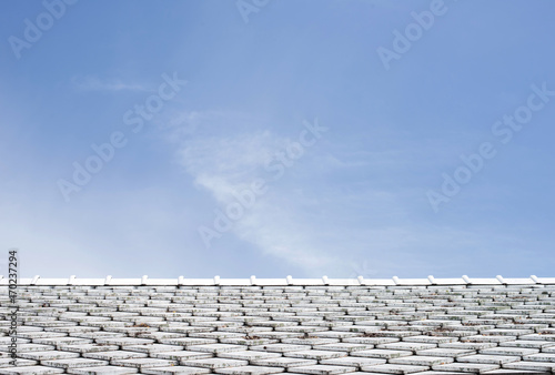 white roof tiles with sky background