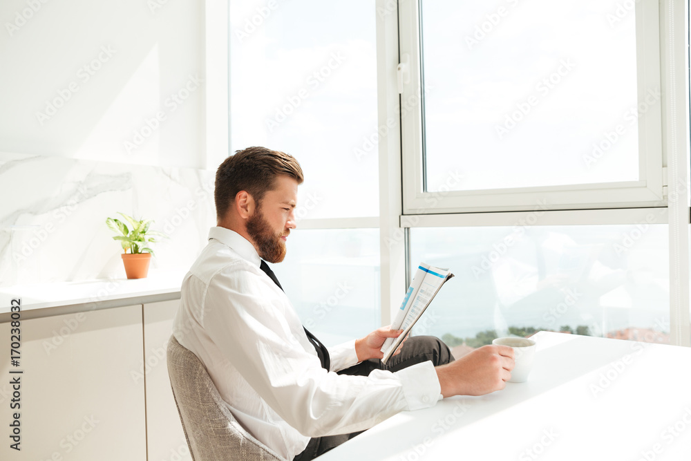 Side view of bearded man in business clothes Side view of bearded man in business clothes