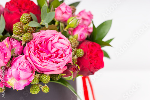 Close up of beautiful bouquet of pink and red roses isolated on white background