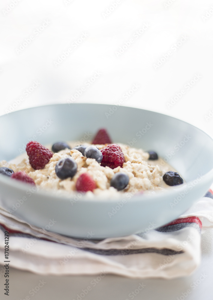 Healthy breakfast - oatmeal with blueberries and raspberries