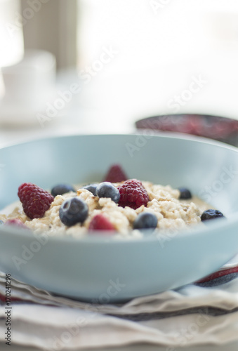 Healthy breakfast - oatmeal with blueberries and raspberries