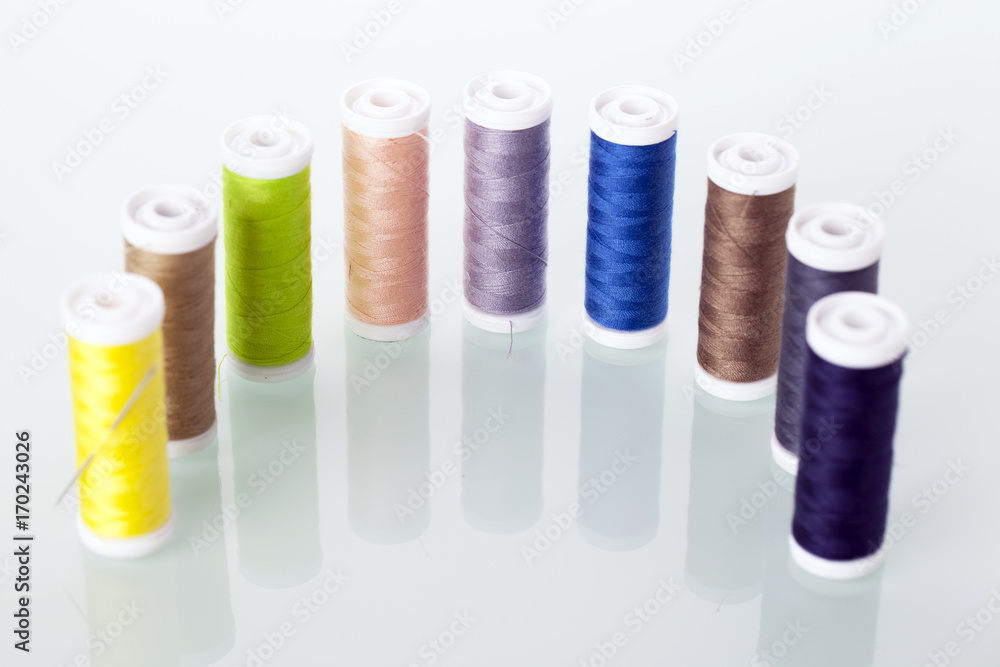 Sewing equipment and threads on white background. Sewing equipment and threads on white background.